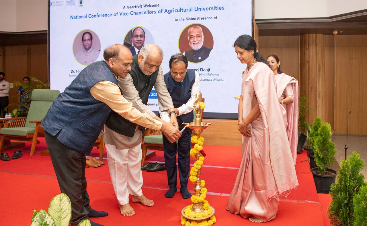 Dr. R.C. Agrawal, Rev. Daaji and Dr. Himanshu Pathak lighting the lamp during the inaugural National Conference of Vice Chancellors of Agricultural Universities.