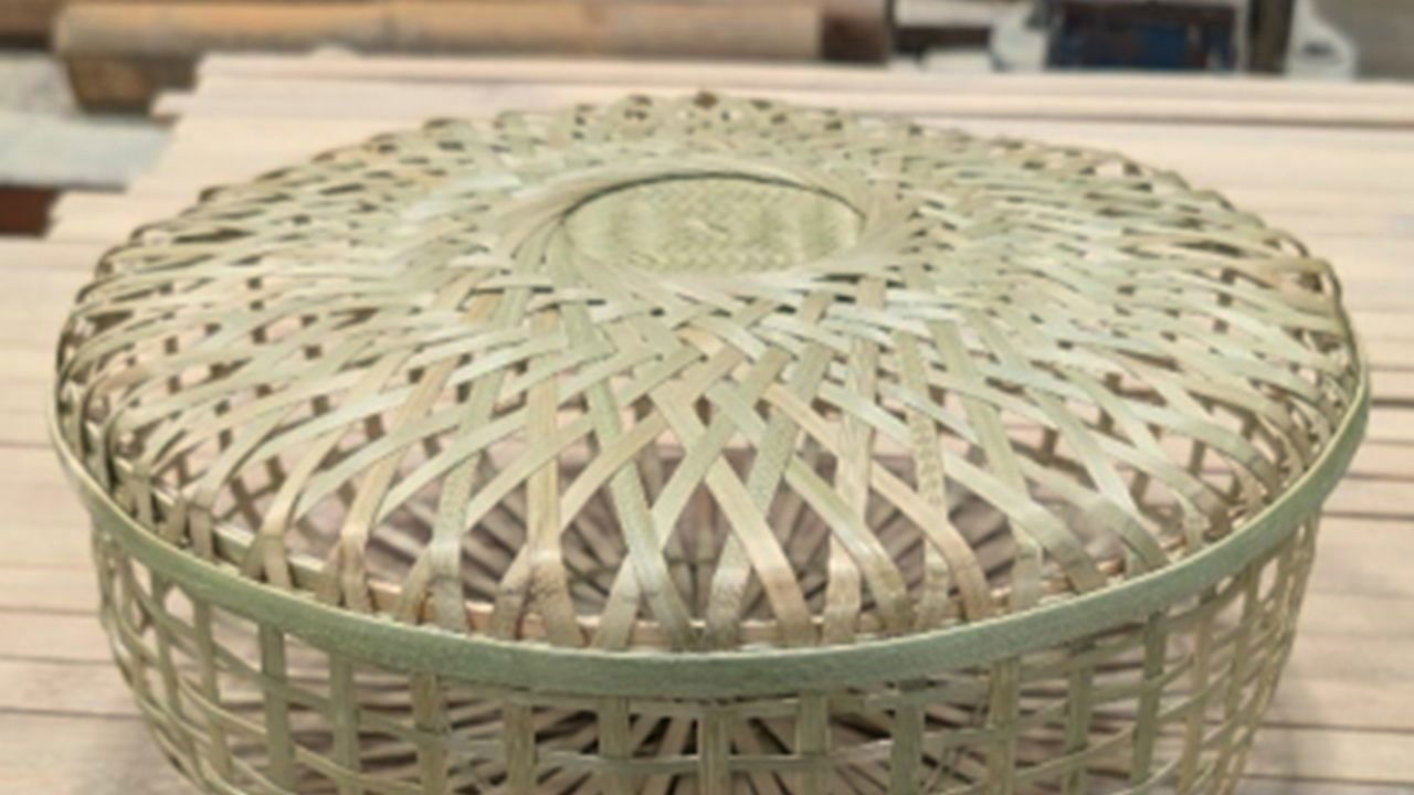 An intricately woven bamboo basket