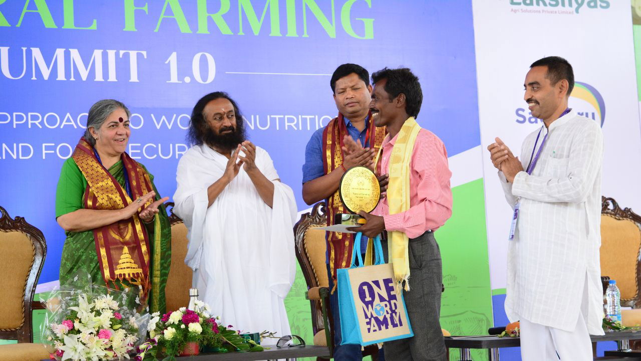 B. Naidu receives a prestigious award from spiritual leader Sri Sri Ravi Shankar