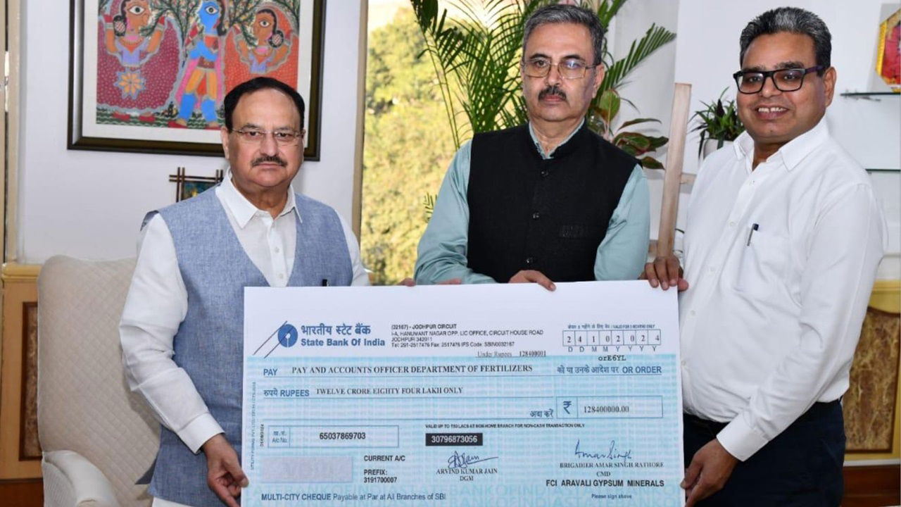 Brig Amar Singh Rathore CMD, FAGMIL presents a dividend cheque of Rs 12.84 Cr for the year 2023-24 to Minister of Chemicals and Fertilizers, Jagat Prakash Nadda, in the presence of Bharat Bhushan, Senior Economic Advisor,DoF. (Photo Source: @fagmil1/X)