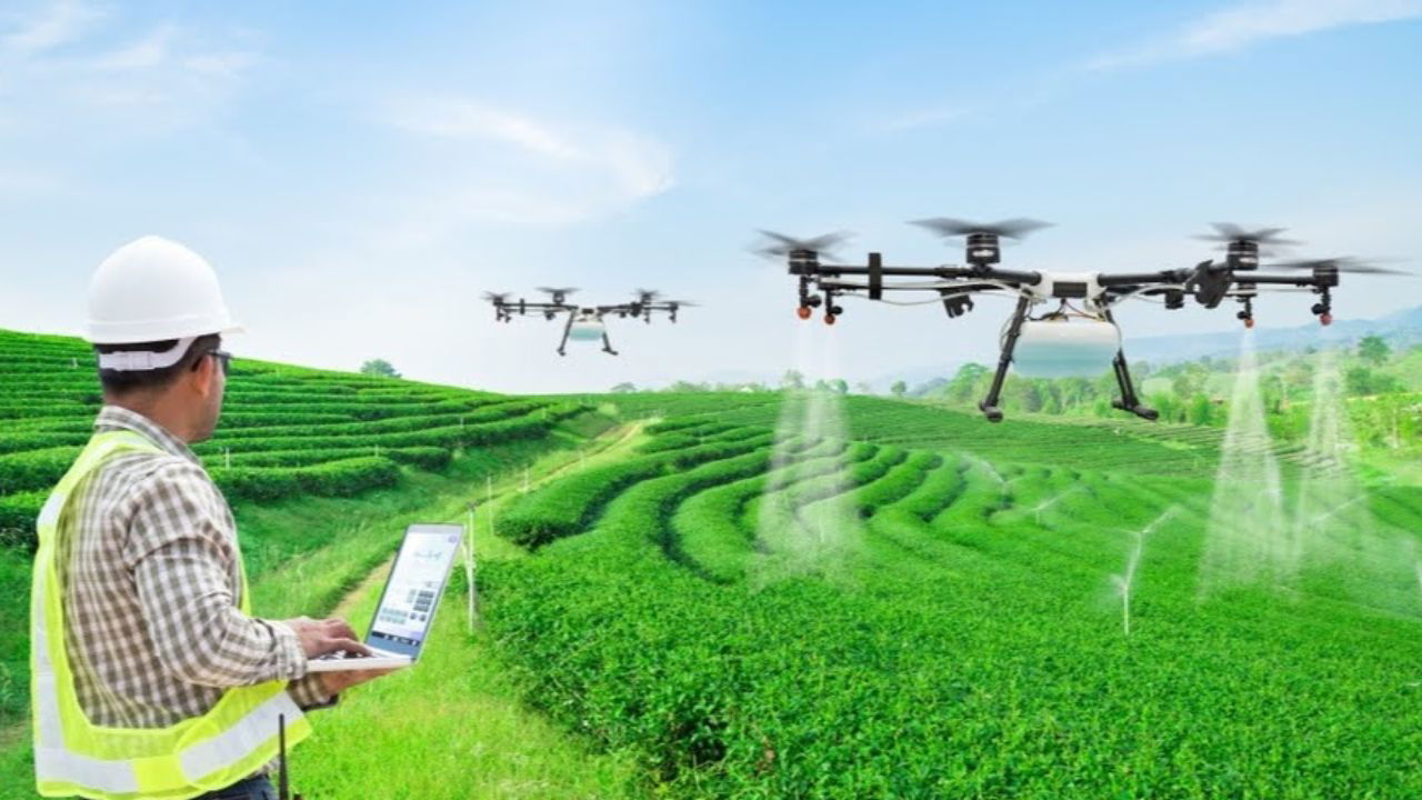 Farmer using agricultural drones for precision spraying in a lush, terraced green field (Representational Image Source: Indian Statistical Institute)