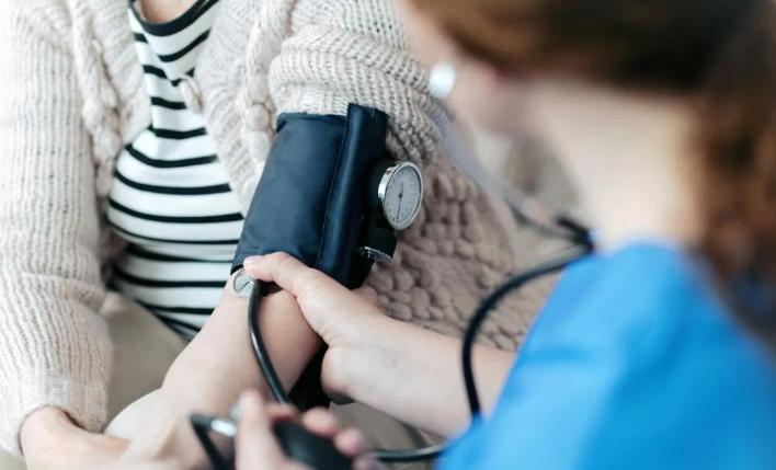 Doctor Checking Blood Pressure of a Patient