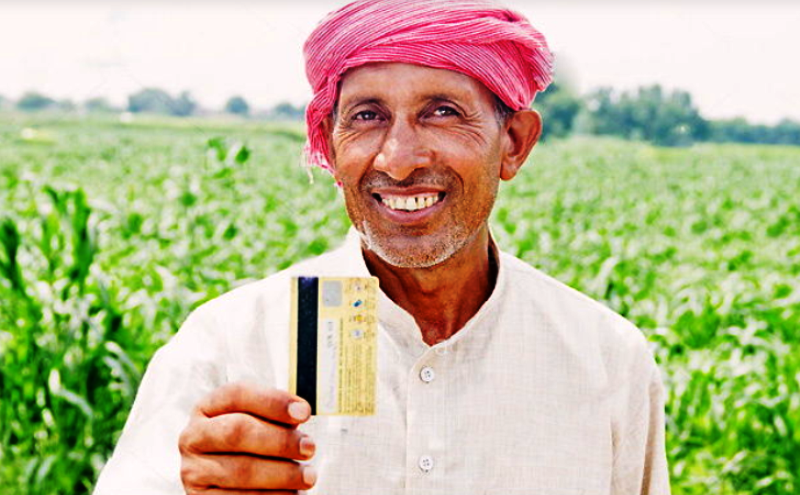 We can see a farmer to hold a kisan credit cards of a Uttar Pradesh Kisan Loan Redemption Scheme
