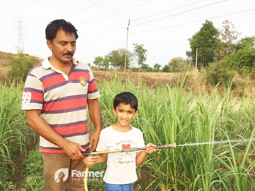 Jagadeesh Reddy with his kid at his farm