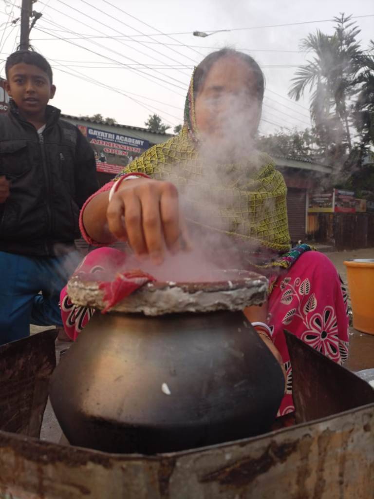 Woman preparing Bhaka Pitha