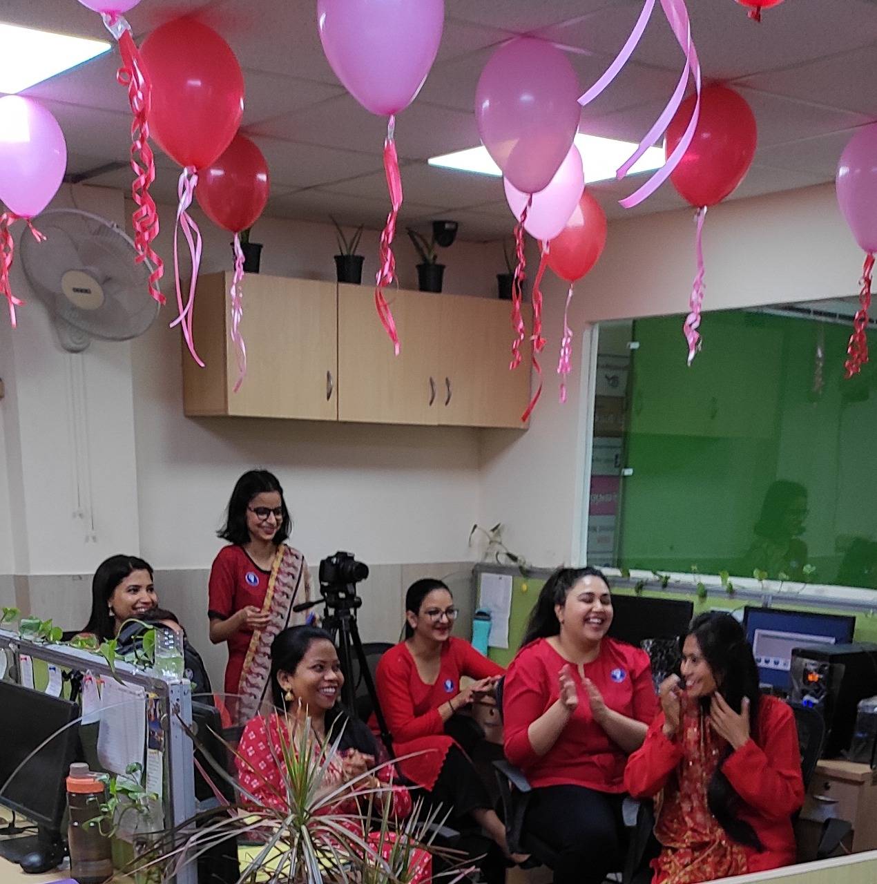 The ladies in red cheering the ramp walking gentlemen