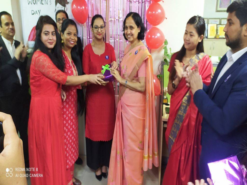 Senior employees of KJ - (from left to right) Manisha Sharma, Abha Toppo, and Megha Sharma presenting gift to Shiny ma'am