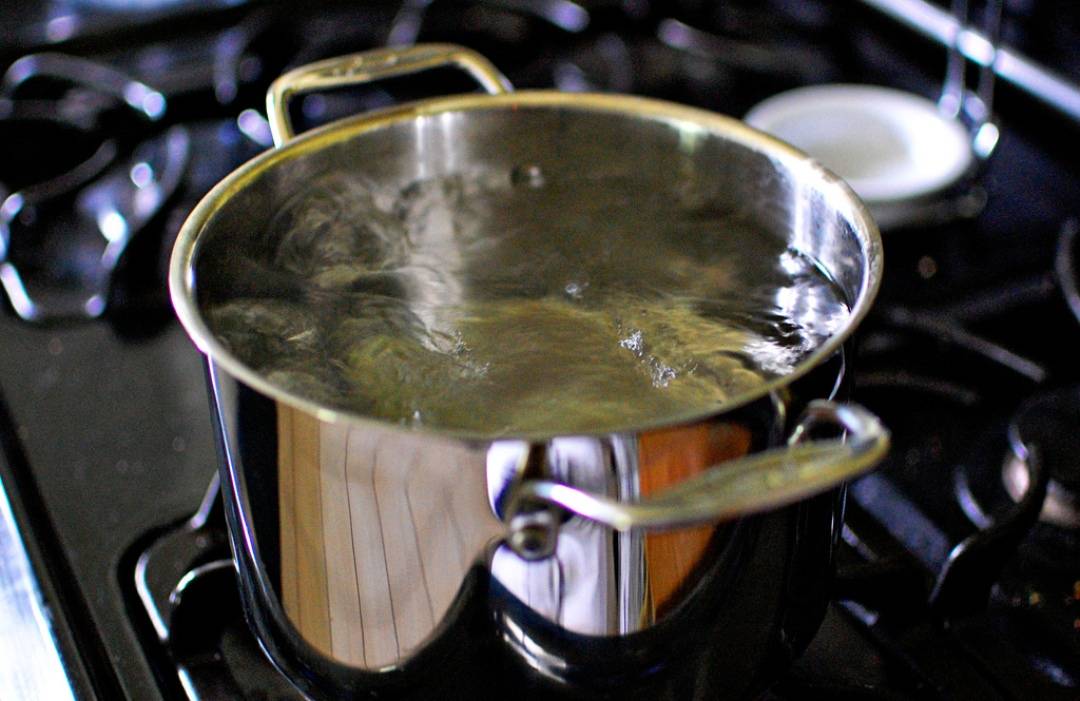 Guava leaves being boiled in water