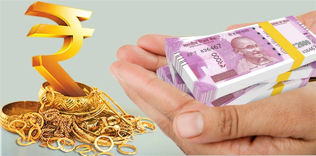 Gold jewellery and money in hand