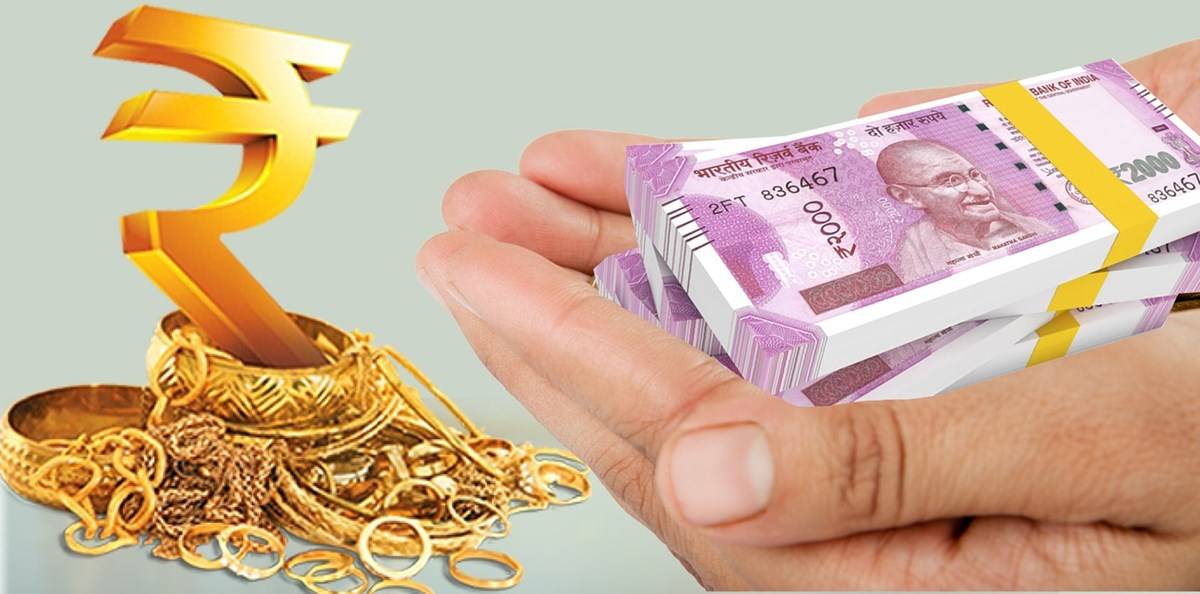Gold jewellery and money in hand