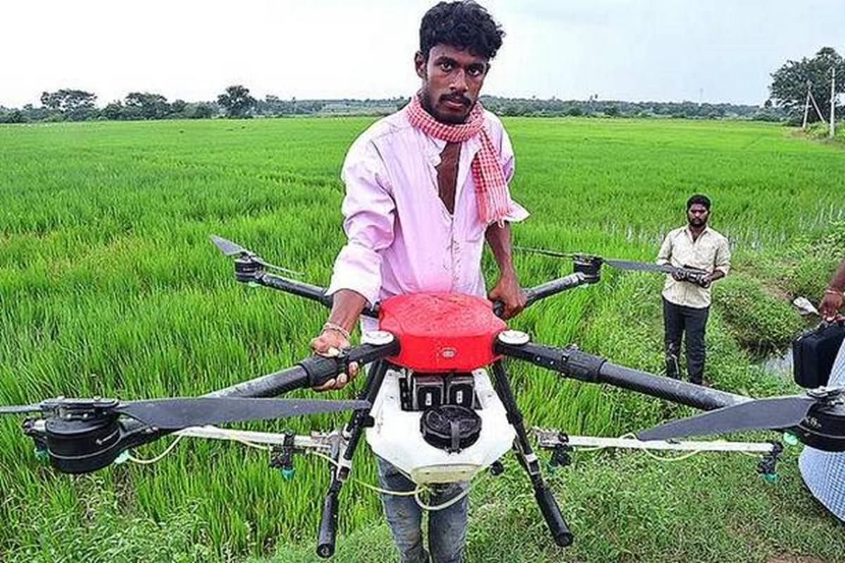 Farmer holding machine of spraying crop