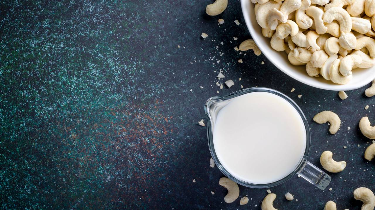 cashew and cashew milk on table