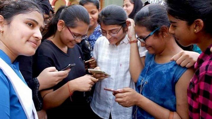 Students with mobile phones