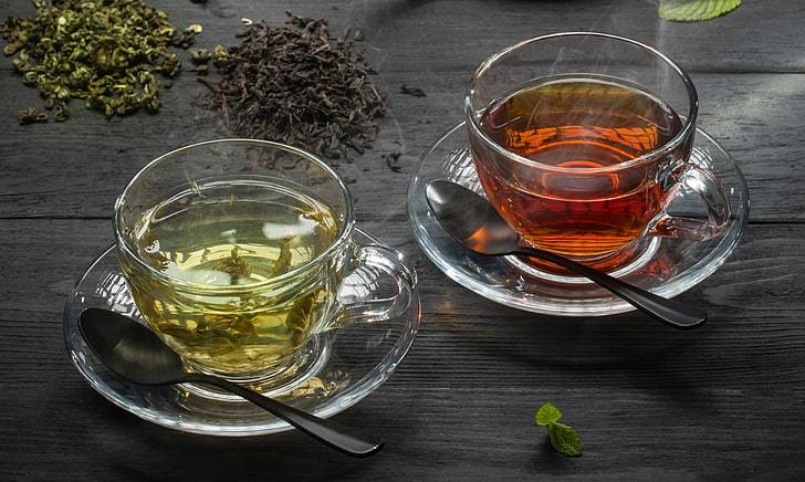 Green Tea In Cups And Its leaves