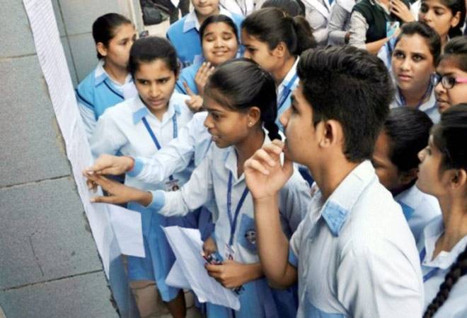 Students reading their Date-sheets for Board Exam