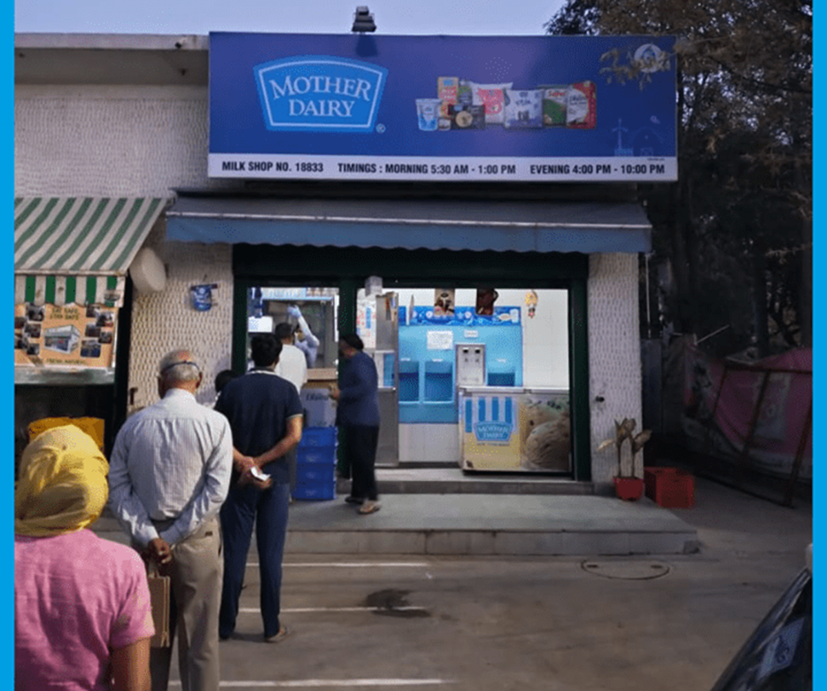 People standing in a Queue near Mother Dairy