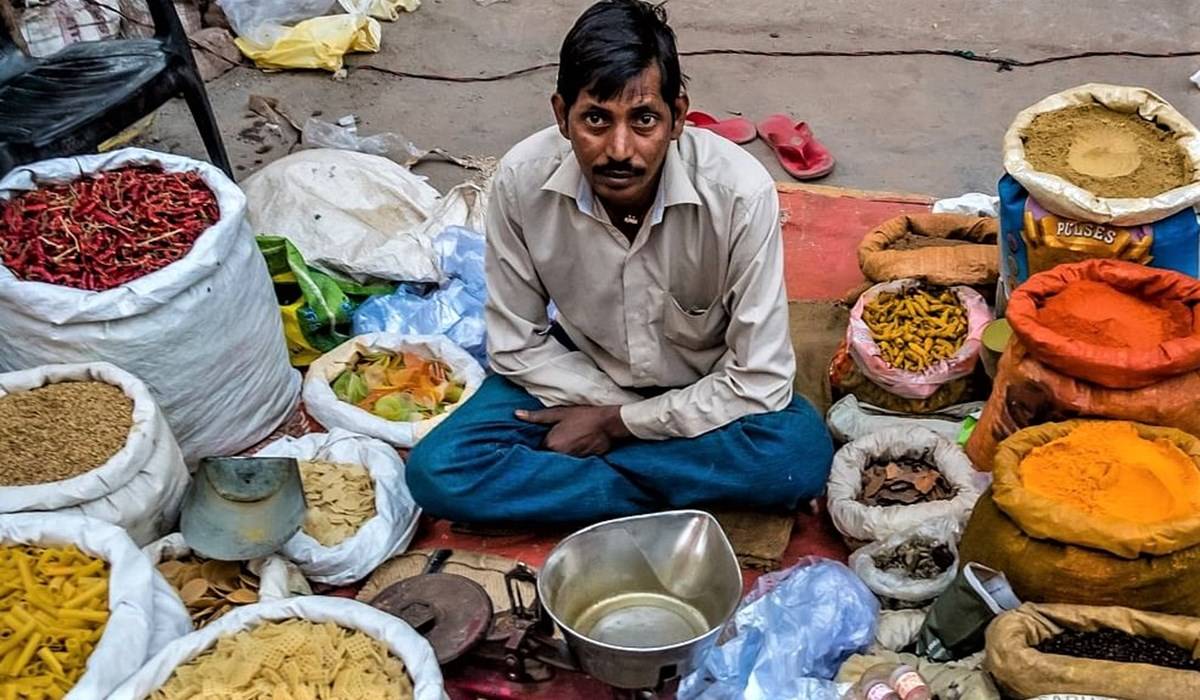 Man selling spices in an open market
