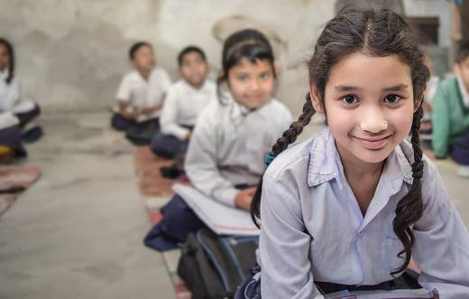 Girls sitting in the school