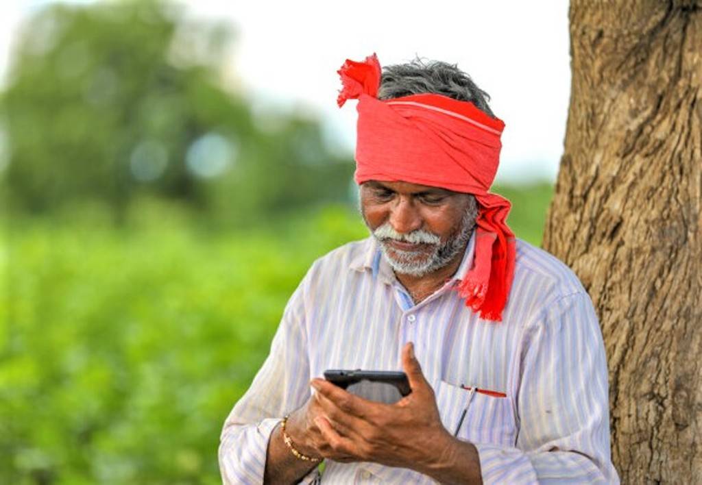 Farmer Using Agri-Mobile App