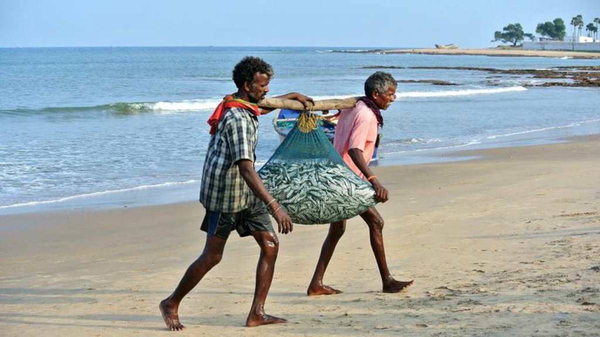 Two Fishermen carrying fishes