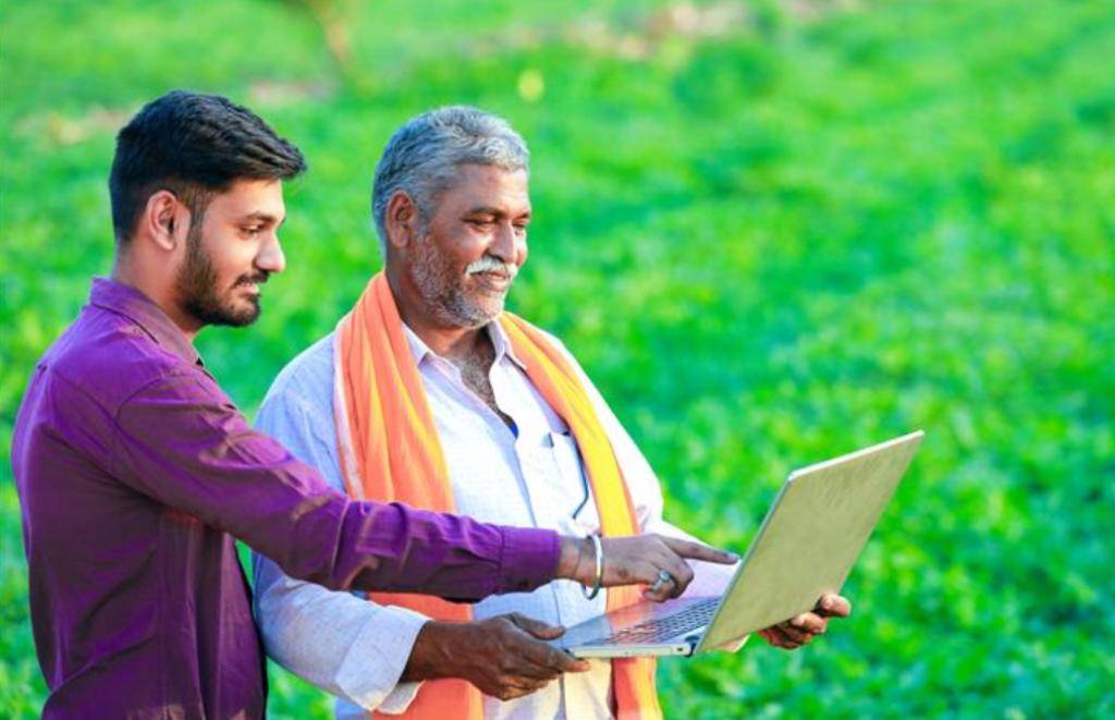 Agronomy Sales Manager Teaching Farmer About Their Land