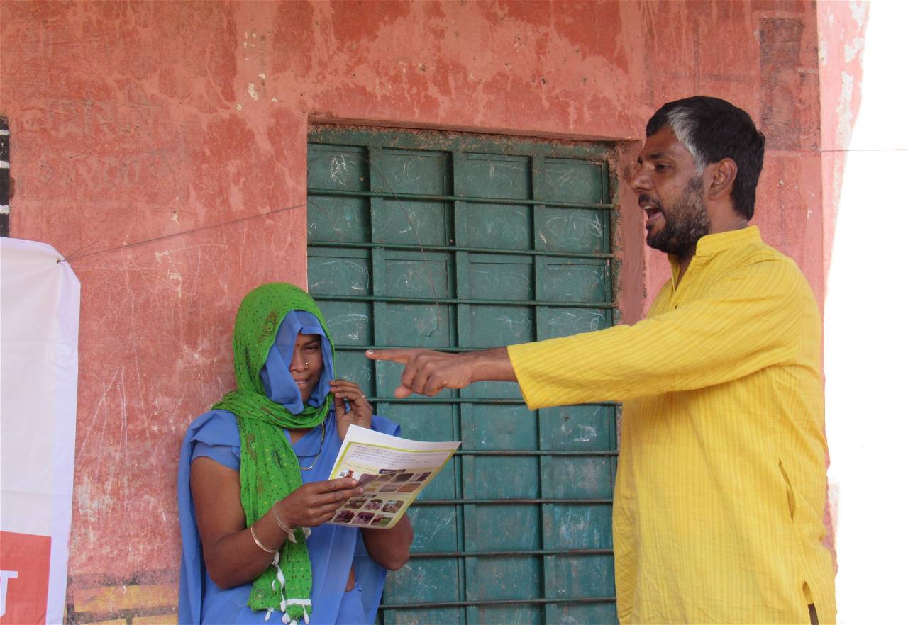 Jayesh Joshi- Secretary of VAAGDHARA, interacting with a tribal farmer