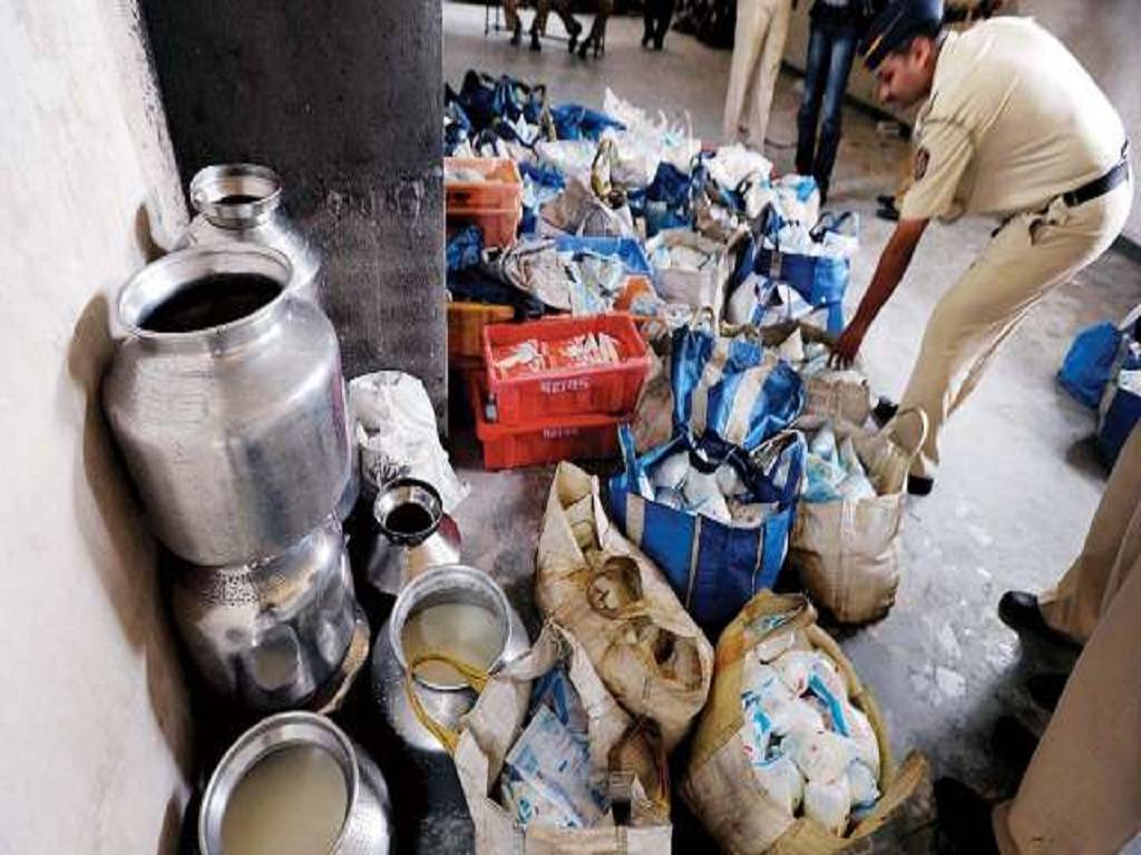 Picture of police raiding & checking products in the milk factory in Telangana