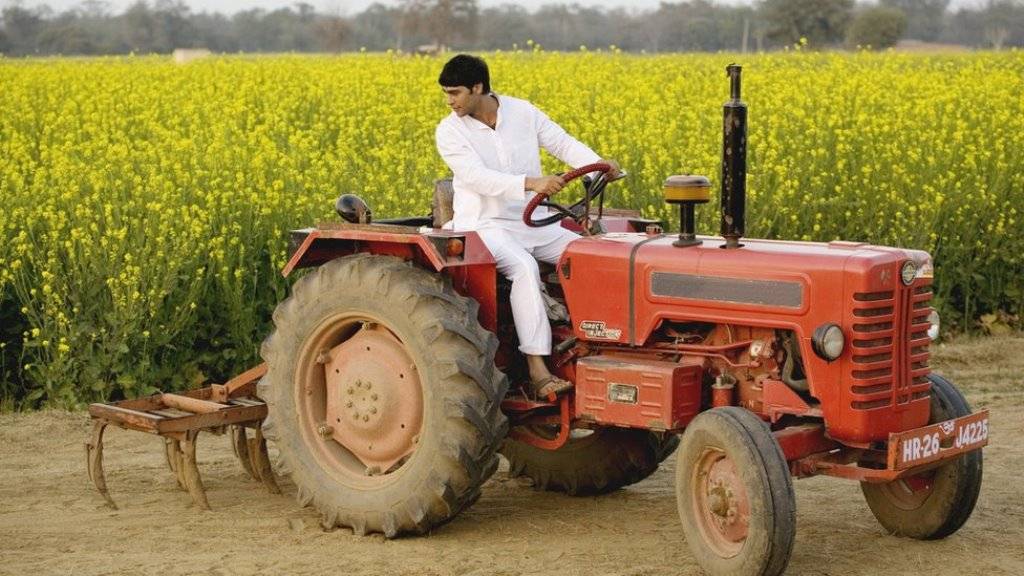 A Farmer with his tractor