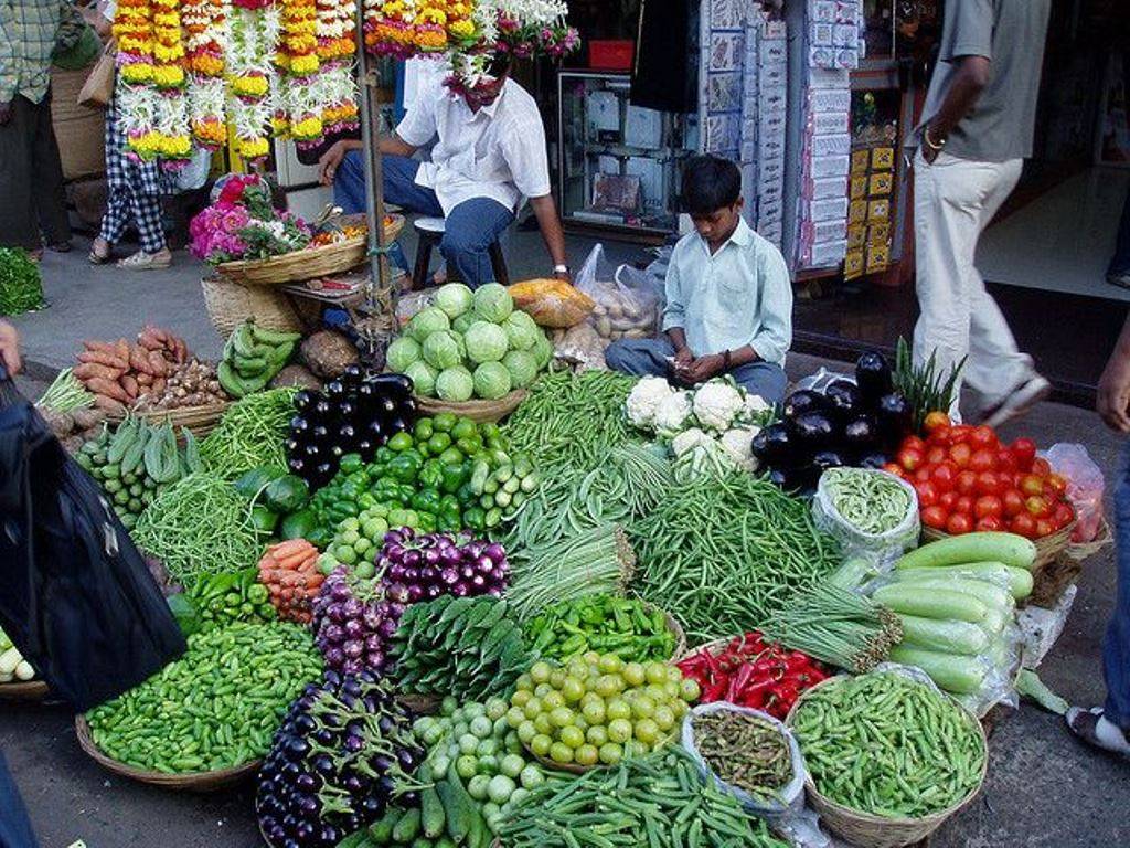 A child selling vegetable in the market