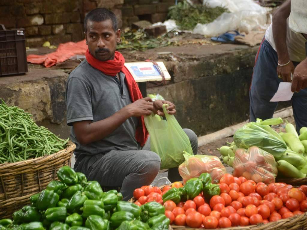 A Man Selling Vegetables in the Market
