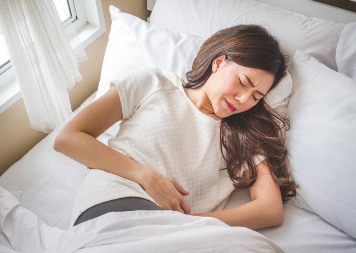 A Girl facing stomach pain due to food poisoning