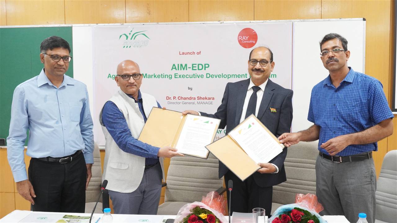 Dr. P. Chandra Shekara & Raj Kumar Agarwal seen exchanging MoU to organize a 3 day AIM-EDP