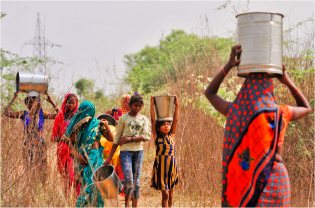 Women and children carrying water