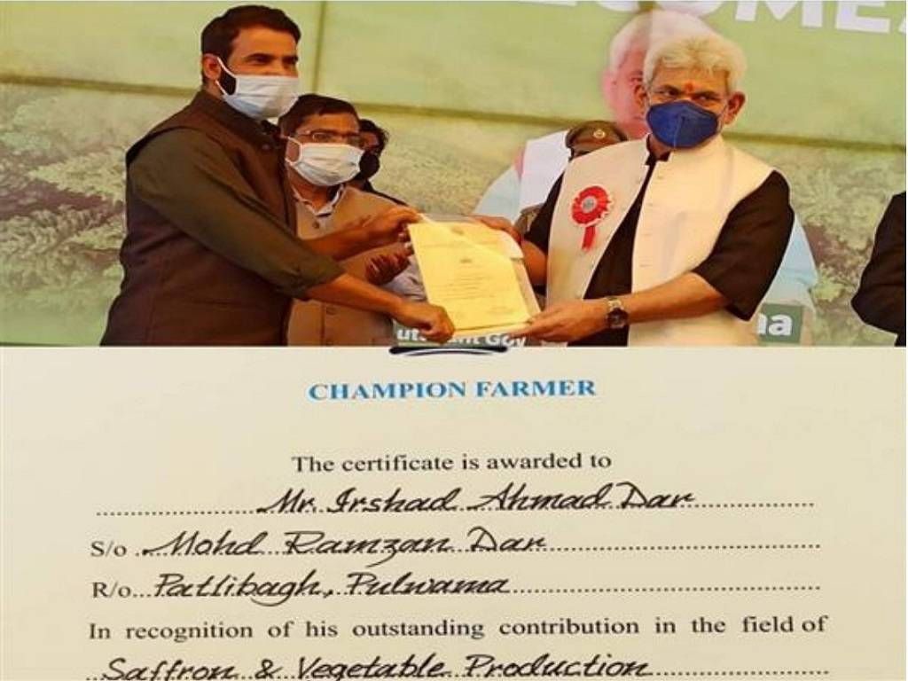 Irshad Ahmad Dar has been recognized as "Champion Farmer" for his contributions to the vegetable and saffron cultivation