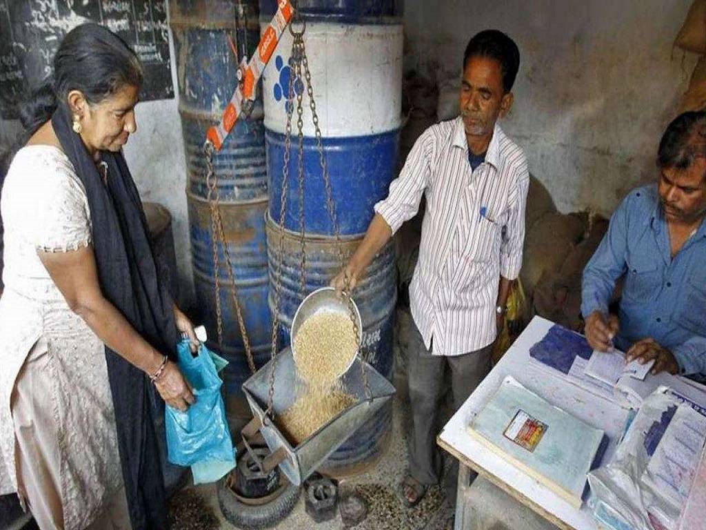 People get food grains from a ration shop at subsidised rates.