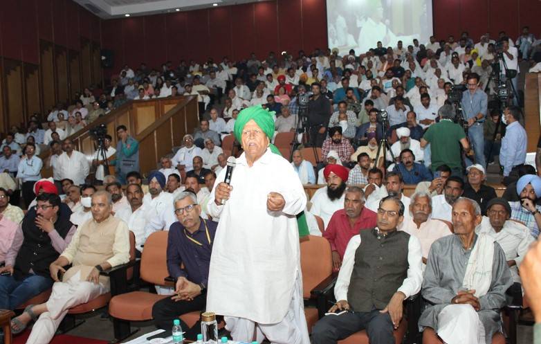 A farmer sharing his experience with participants