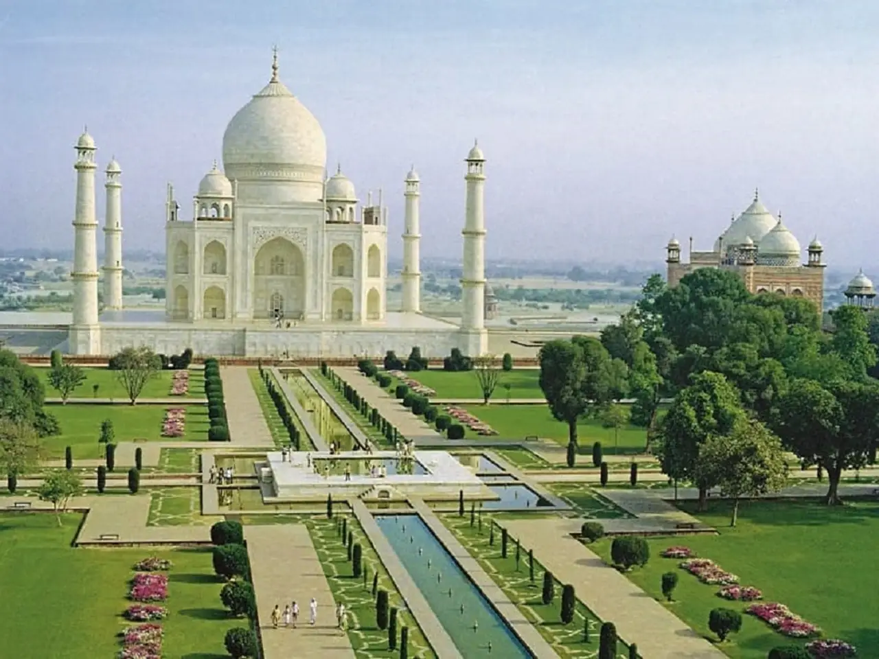 The Taj Mahal is surrounded by beautiful Persian gardens.  The garden style seen within the Taj Mahal complex is Persian Timurid.