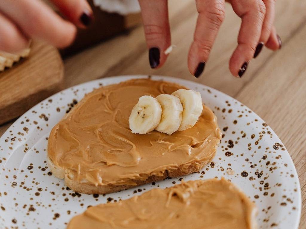 The history of peanut butter begins with, of course, peanuts, which are not nuts, but legumes, like peas and beans.