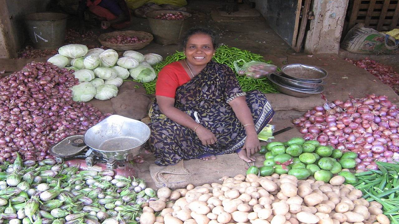 Women Vendor selling produce at the Saturday market by Haritham Organic Group