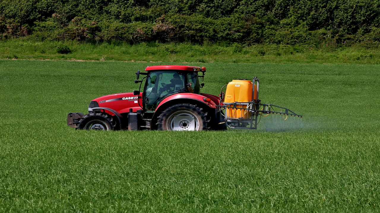 Tractors spreading insecticides (Photo Courtesy: Pixabay)