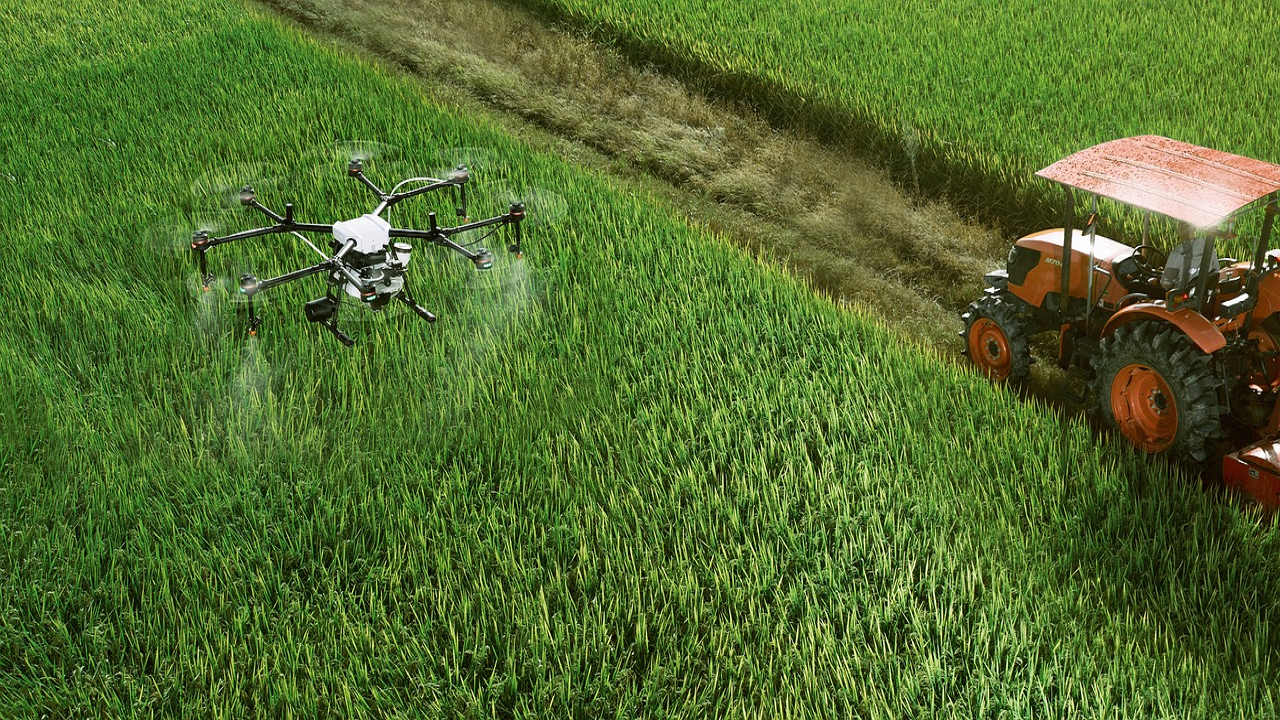 Farmers using tractor and drones in their field (Photo Courtesy: Pixabay)