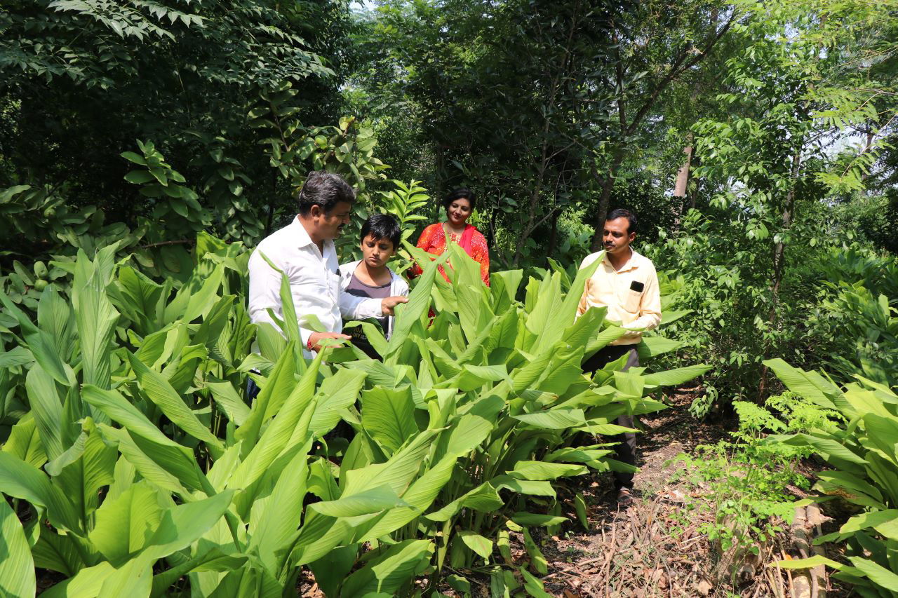 Laxmikanth Hibare and family observing crop