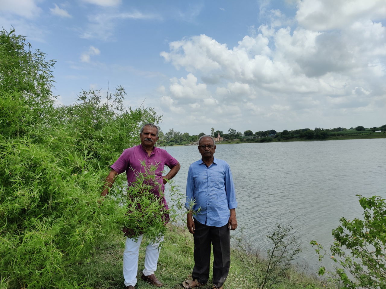 Mahadev Gomare, The Art of Living project lead along with a farmer in Latur