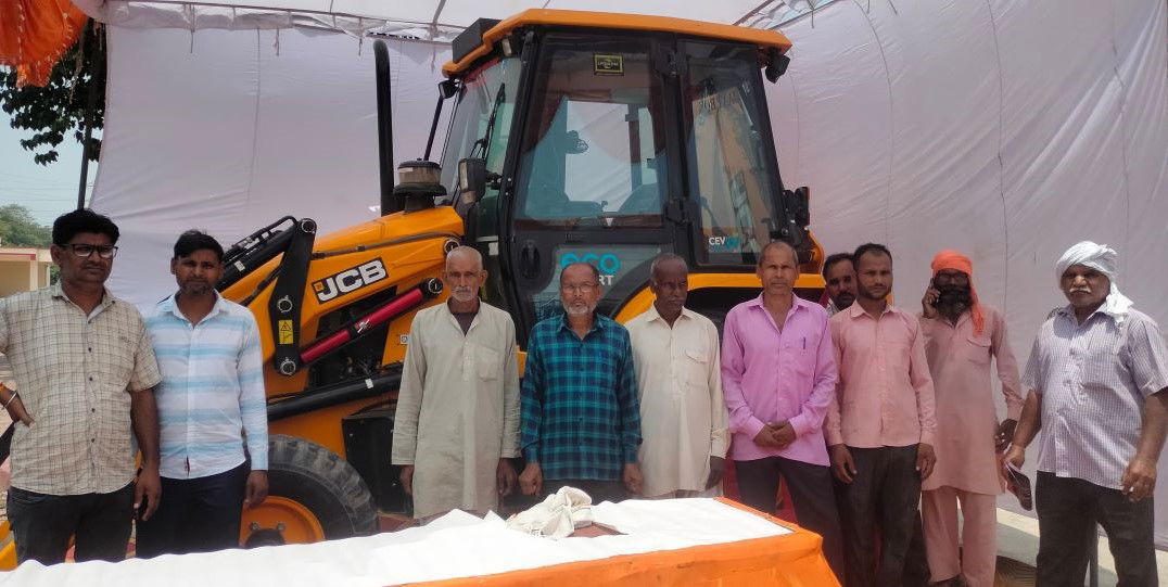 Farmers at the stall of JCB