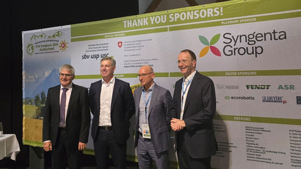 Jeff Rowe, CEO of Syngenta and Mark Schneider, CEO of Nestlé along with two other dignitaries (Photo Source: IFAJ/Flickr)